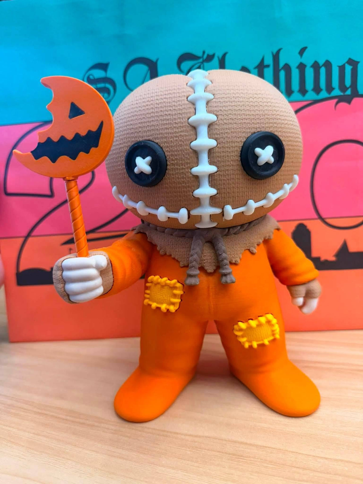 3D-printed burlap sack Halloween figure soap holder with button eyes and pumpkin sucker prop, horror-inspired bathroom soap dish